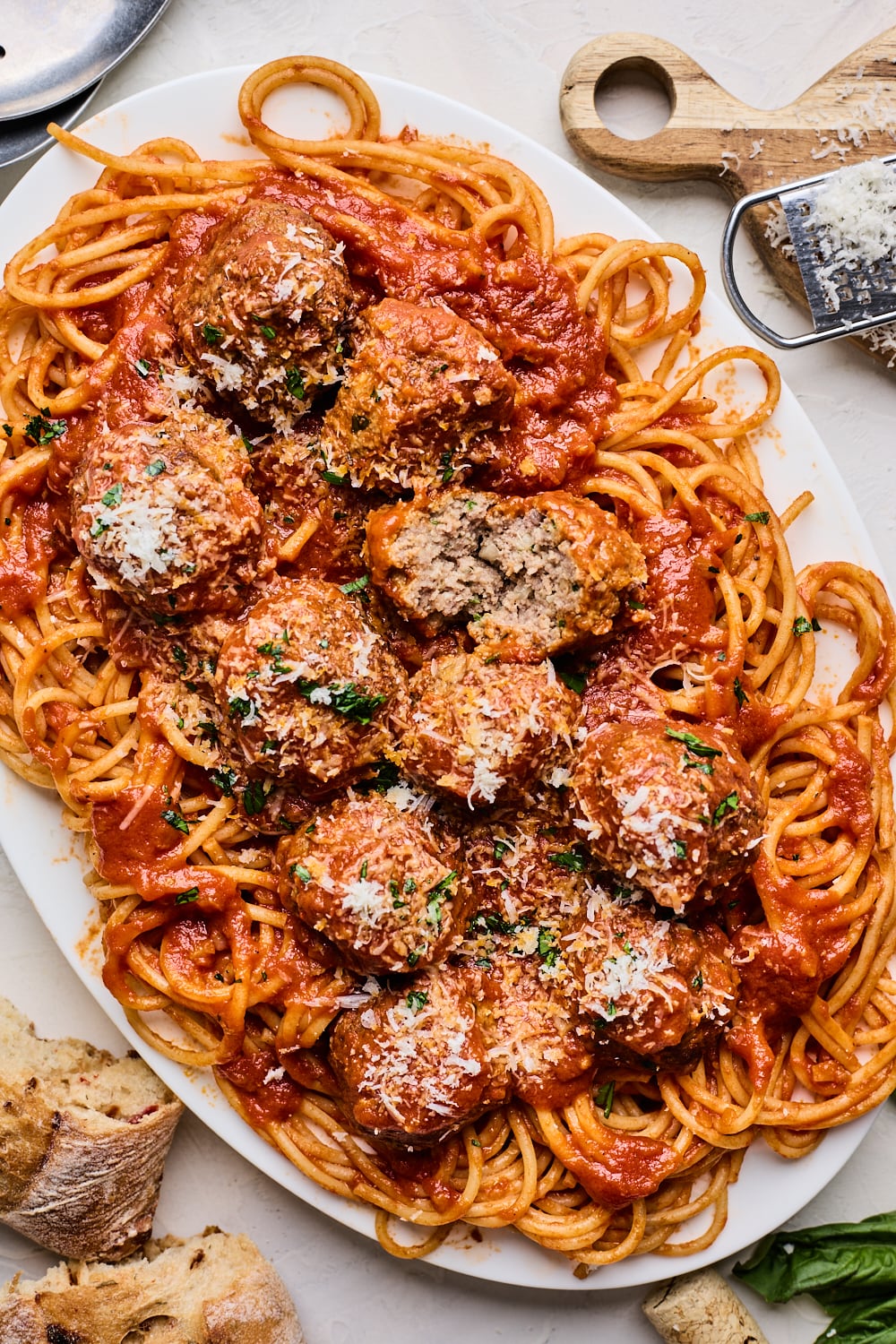 Spaghetti Meatballs on a platter with one cut open