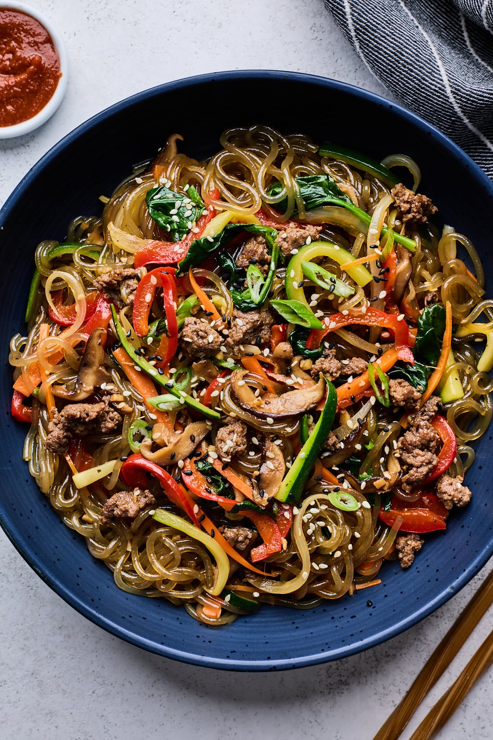 Japchae in a blue bowl