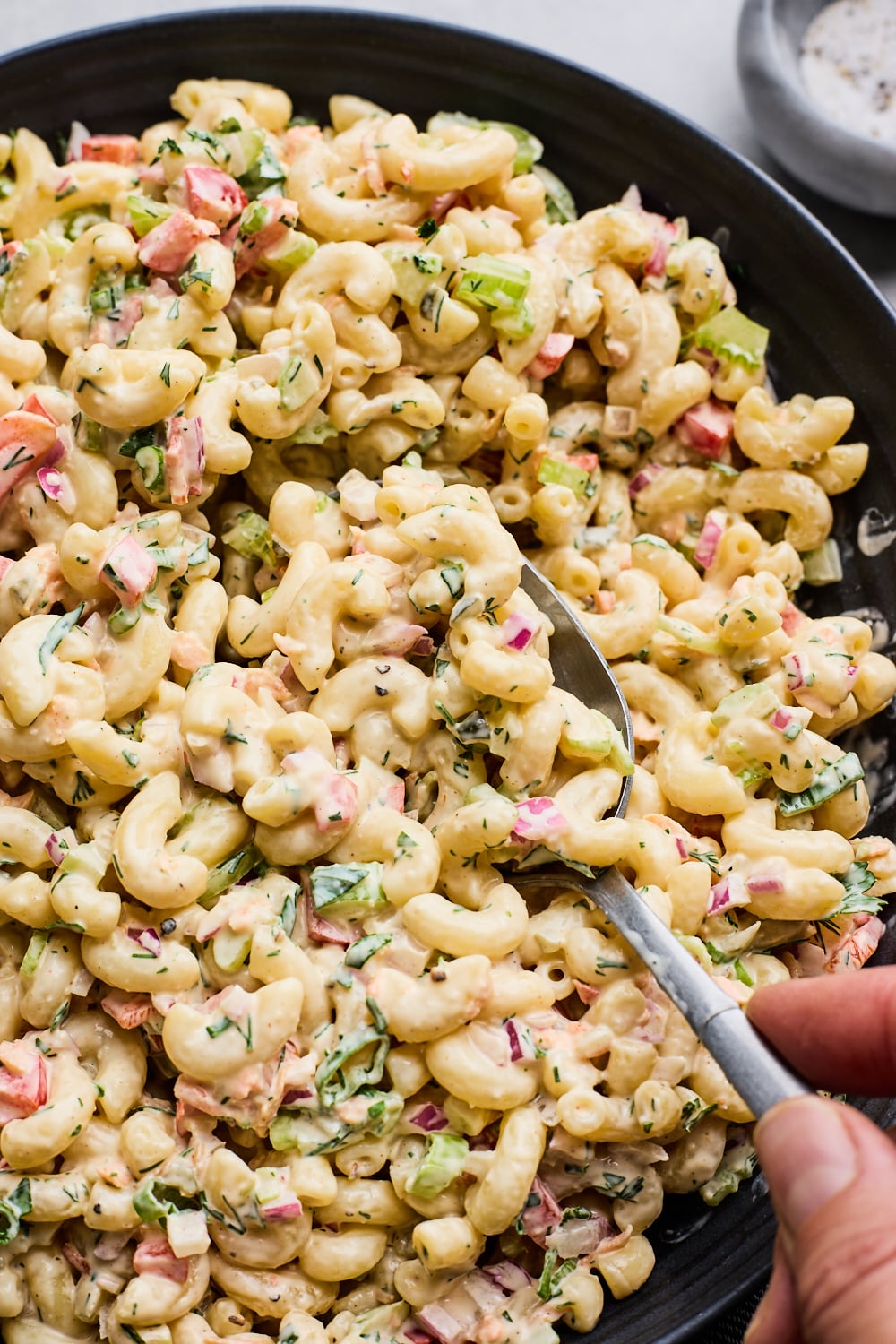 Creamy Classic Macaroni Salad in a black bowl