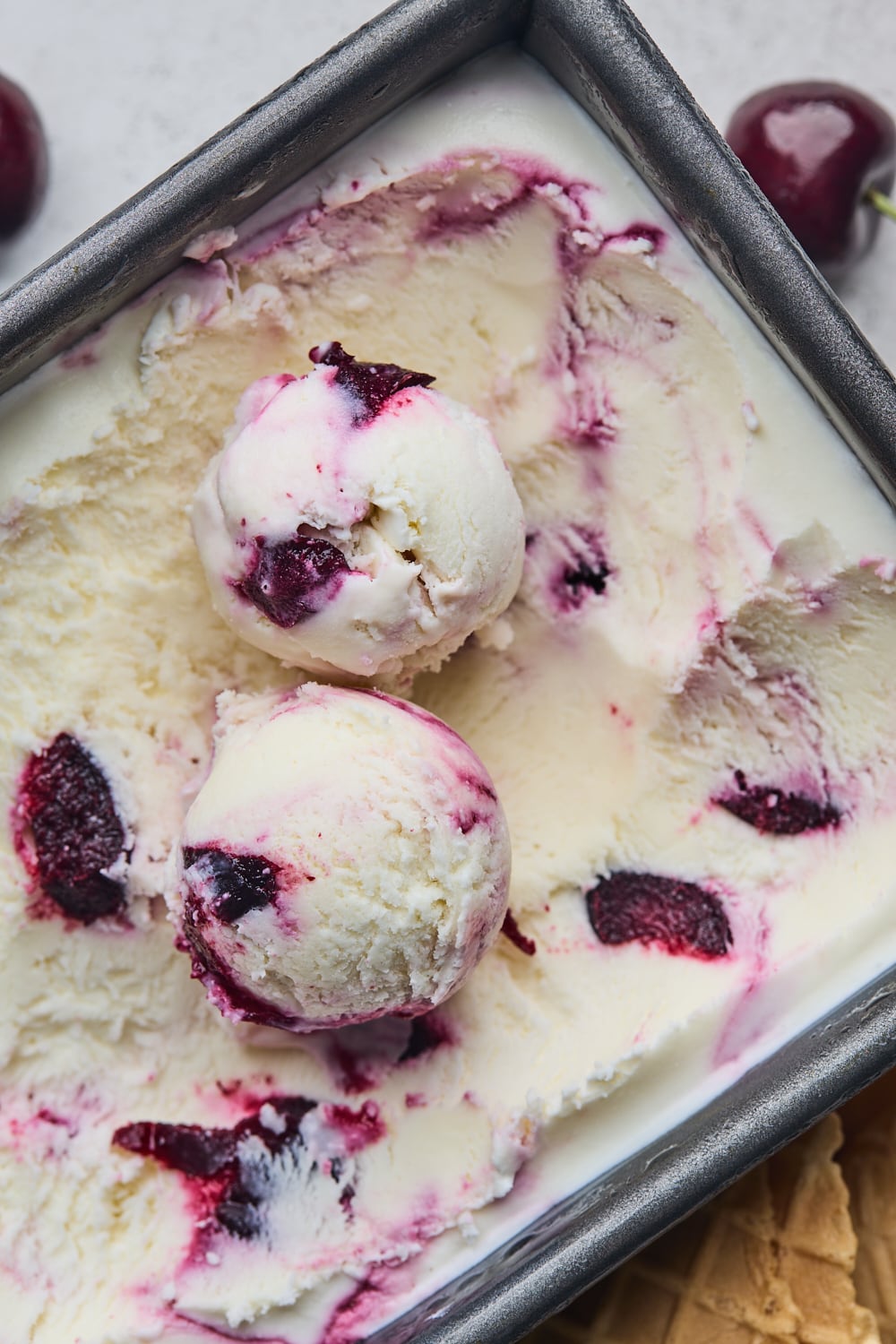 No Churn Cherry Ice Cream Scoops in a container